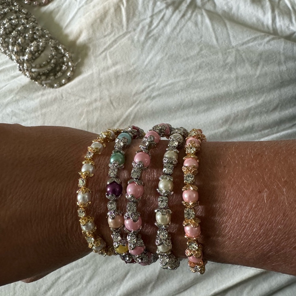 172 baby and kids Pearl and rhinestone bangles in a big lot.